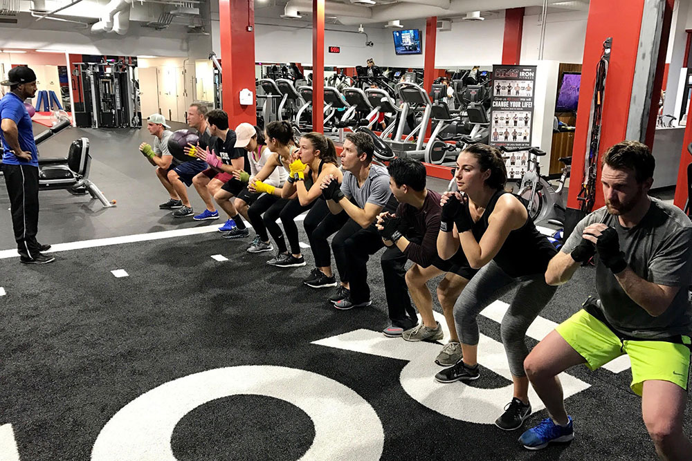 Teams who squat together, stay together! Our monthly group fitness experience.